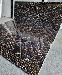 Gạch lát cầu thang 47x120 đen vân đá vàng sang trọng